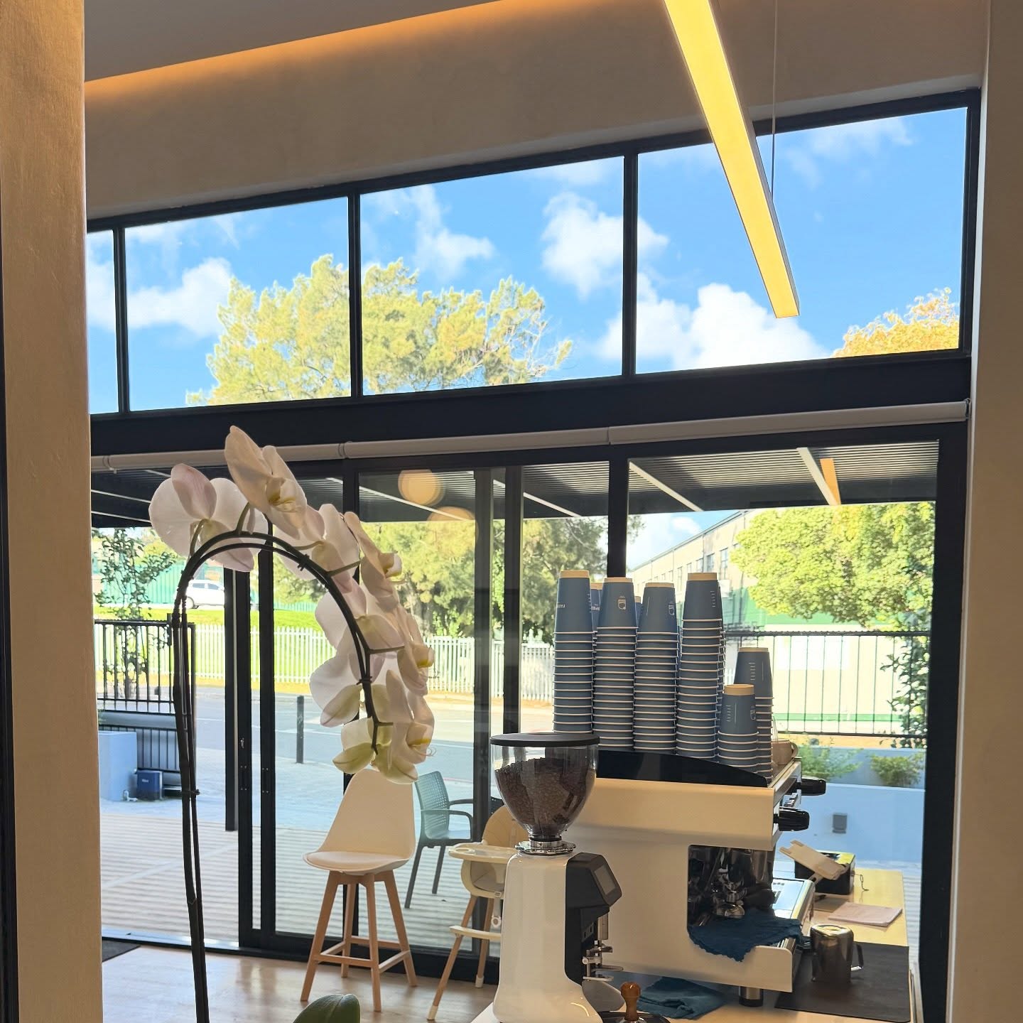 View through the doorway to the coffee bar and patio at Fairfield Coffee