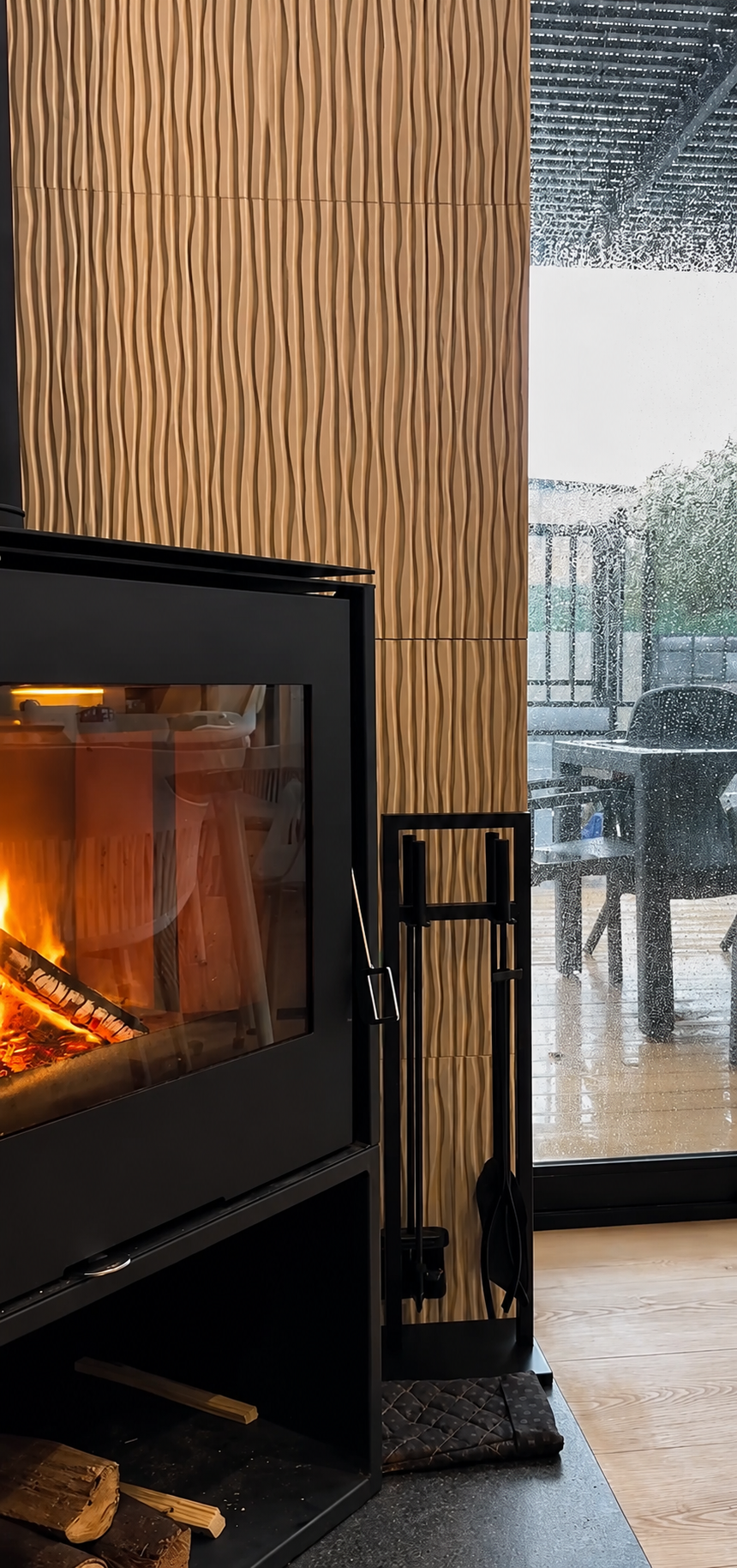 Wood-burning stove crackling beside the patio doors at Fairfield Coffee