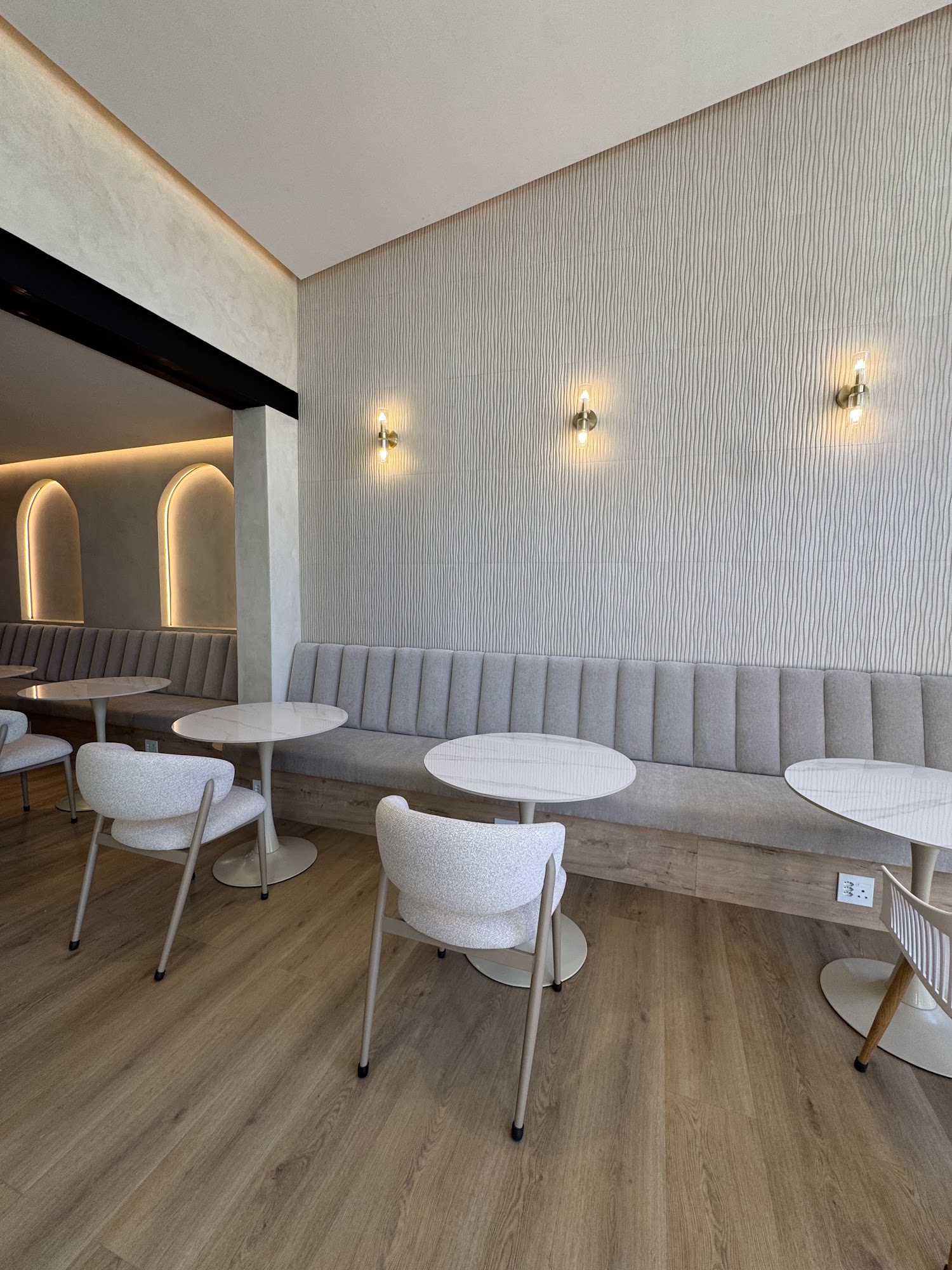 Lounge seating with arched wall niches inside Fairfield Coffee