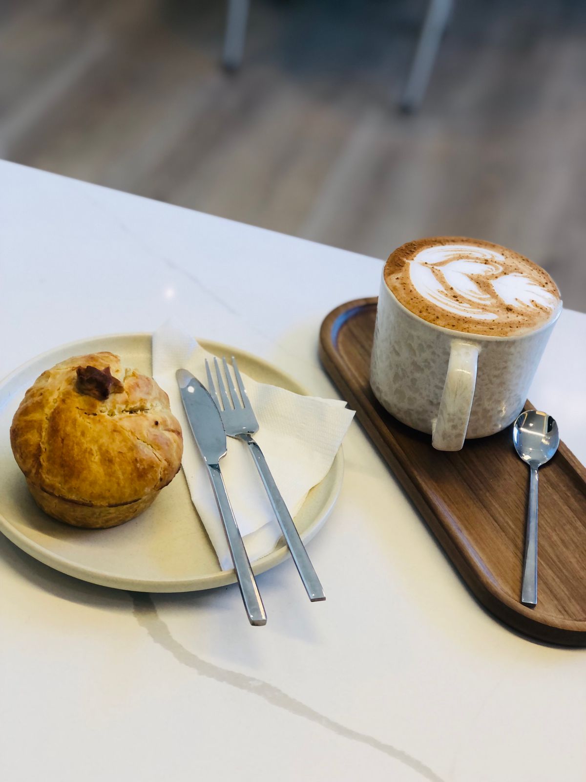 Fresh savoury pastry served alongside a latte at Fairfield Coffee